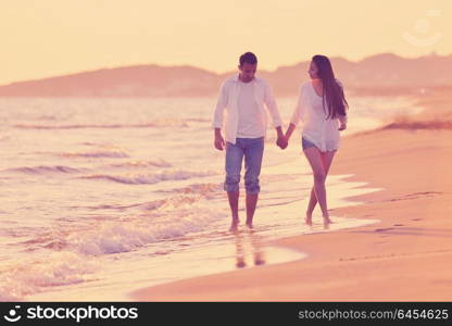 happy young romantic couple in love have fun on beautiful beach at beautiful summer day