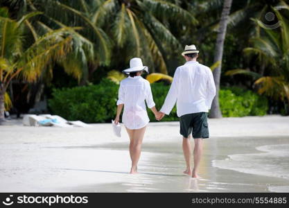 happy young romantic couple in love have fun running and relaxing on beautiful beach