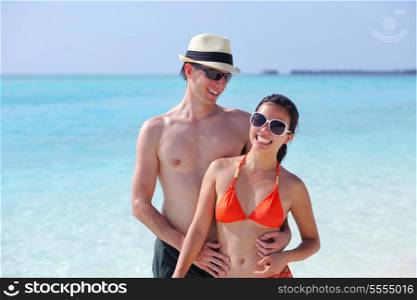 happy young romantic couple in love have fun running and relaxing on beautiful beach