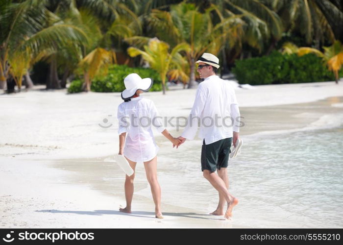 happy young romantic couple in love have fun running and relaxing on beautiful beach