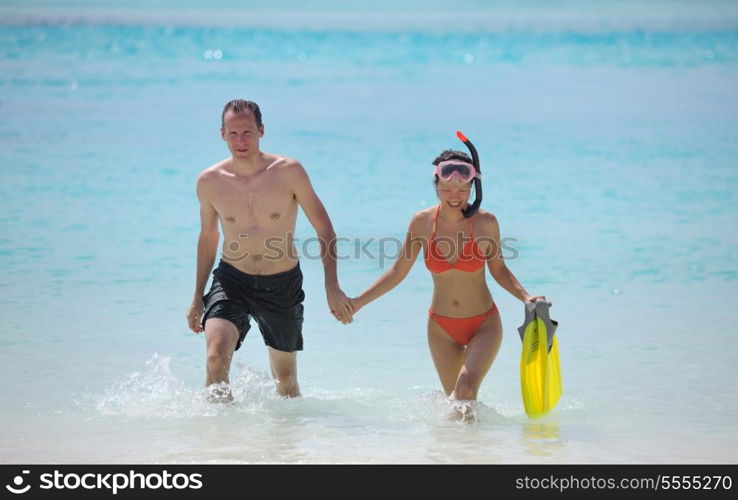 happy young romantic couple in love have fun running and relaxing on beautiful beach