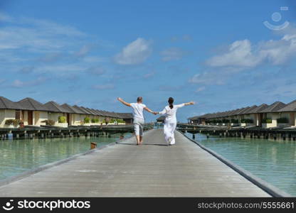 happy young romantic couple in love have fun running and relaxing on beautiful beach