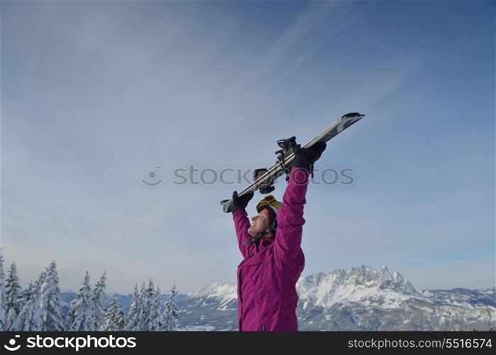 happy young ski woman at mountaint top on winter have fun