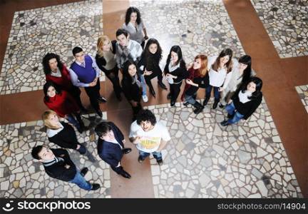 happy young student group posing at university school and classs indoor