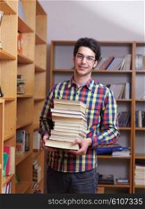 happy young teen boy in school on chemistry classes and library