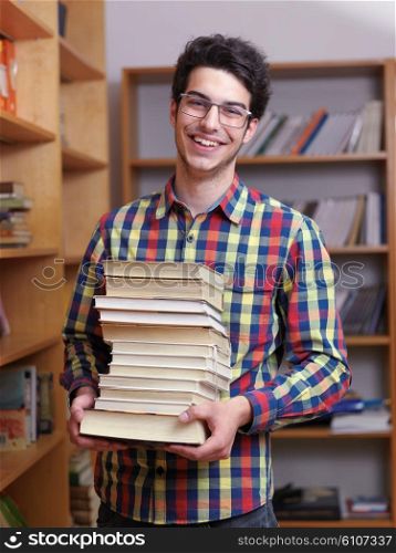 happy young teen boy in school on chemistry classes and library