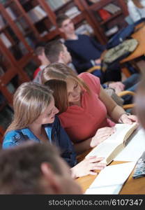 happy young teens group in school on chemisty lessons and library education