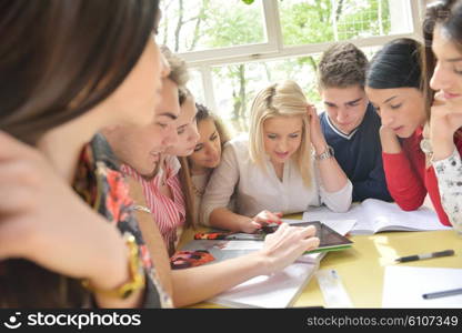 happy young teens group in school on chemisty lessons and library education