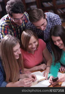 happy young teens group in school on chemisty lessons and library education