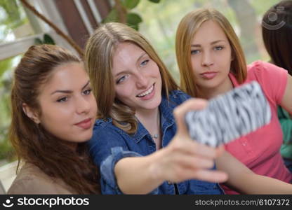 happy young teens group in school on chemisty lessons and library education