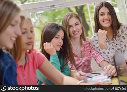 happy young teens group in school on chemisty lessons and library education