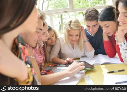 happy young teens group in school on chemisty lessons and library education