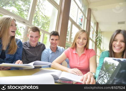 happy young teens group in school on chemisty lessons and library education