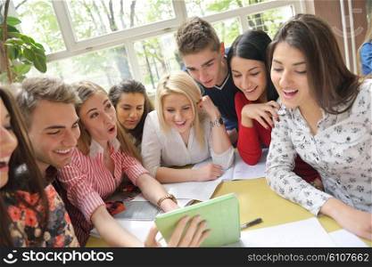 happy young teens group in school on chemisty lessons and library education
