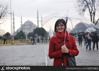 happy young tourist woman travel visit ancient istambul in turkey and old ayasofya blue mosque
