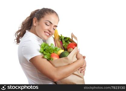 Happy Young Woman Carrying a Shopping Bag Full of Groceries at White Background