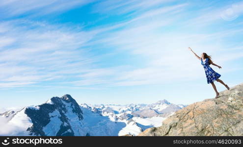 Happy young woman dreaming to fly in sky. Great day for freedom