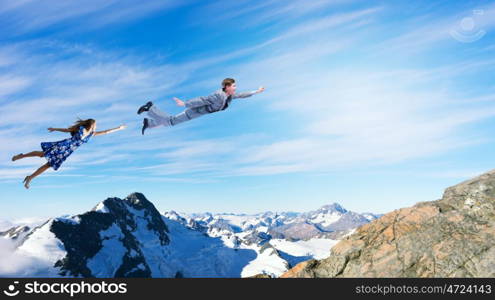 Happy young woman dreaming to fly in sky. Great day for freedom