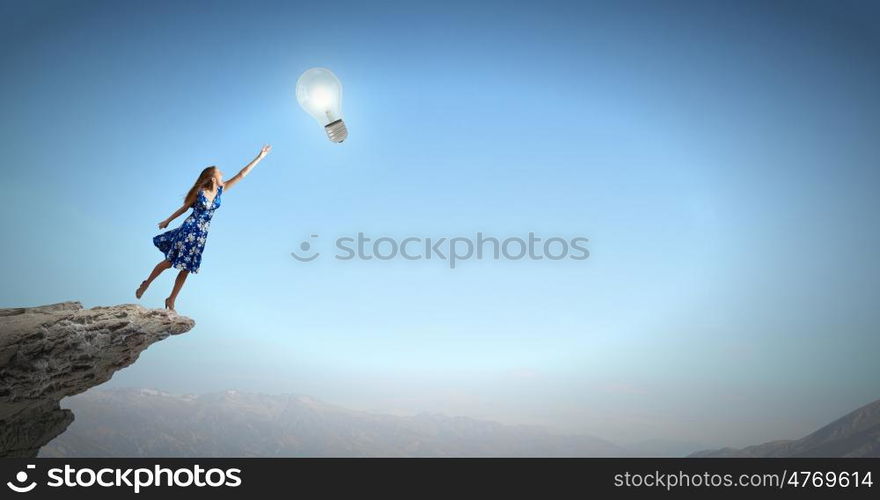 Happy young woman dreaming to fly in sky. Great day for freedom