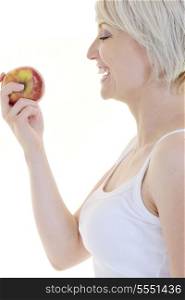 happy young woman eat green apple isolated on white backround in studio