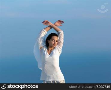 happy young woman enjoy sunset while dancing and enjoy music on headphones