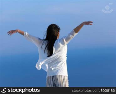 happy young woman enjoy sunset while dancing and enjoy music on headphones
