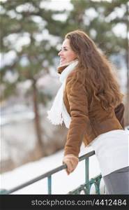 Happy young woman enjoying winter park