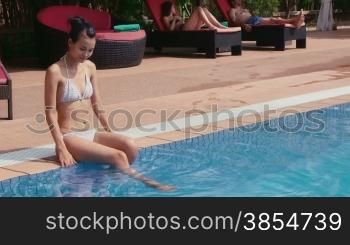 Happy young woman, fun, leisure, lifestyle, vacations and relax near resort swimming pool, portrait of beautiful asian woman looking at camera. 11of27