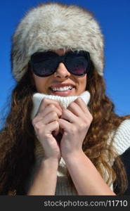 happy young woman having fun at winter nature landscape with fresh snow