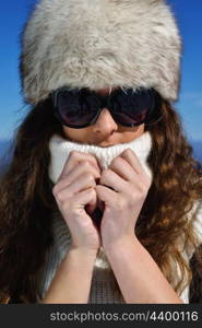 happy young woman having fun at winter nature landscape with fresh snow