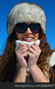 happy young woman having fun at winter nature landscape with fresh snow