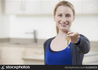 Happy Young Woman Holding Keys To New Home