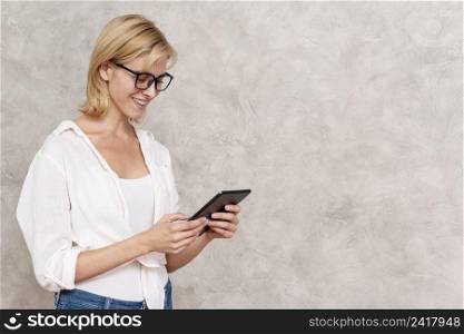 happy young woman holding tablet