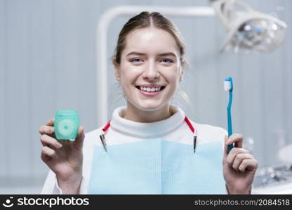 happy young woman holding toothbrush