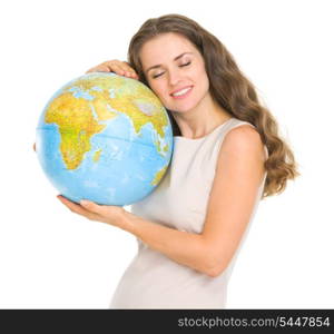 Happy young woman hugging globe