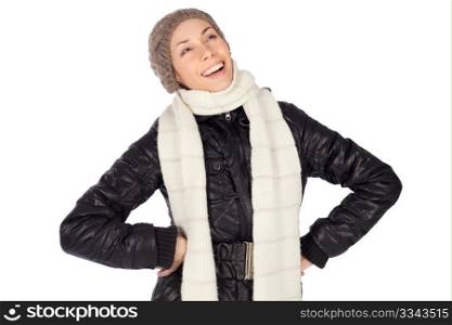 Happy young woman in casual winter clothing and hands on hips laughing, isolated on white background.