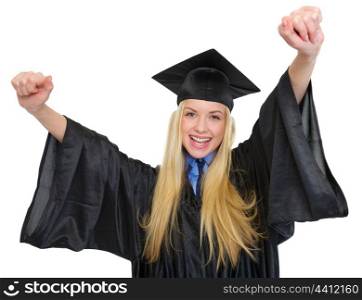 Happy young woman in graduation gown rejoicing success