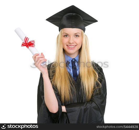 Happy young woman in graduation gown showing diploma
