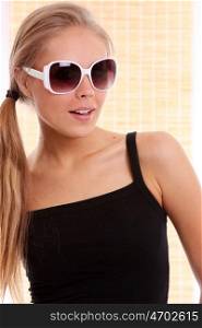 Happy young woman in sunglasses