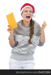Happy young woman in sweater and christmas hat with letter rejoicing