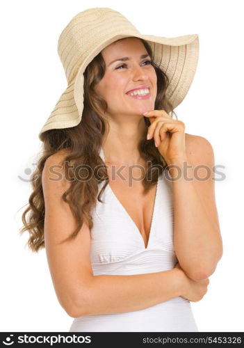Happy young woman in swimsuit and hat looking on copy space