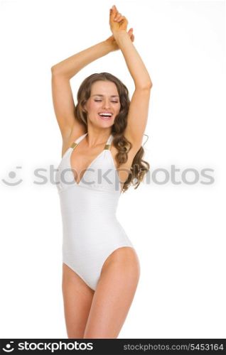 Happy young woman in swimsuit dancing