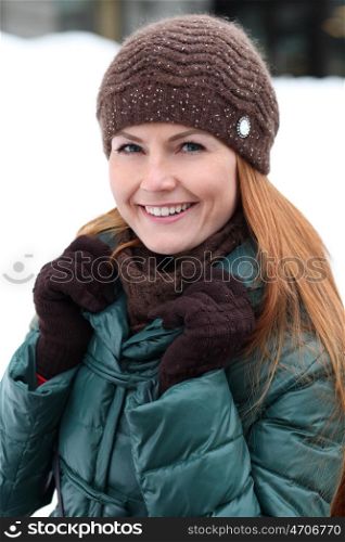 Happy young woman in winter city