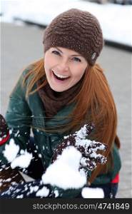 Happy young woman in winter city