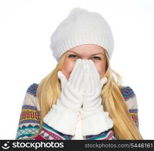 Happy young woman in winter clothes smiling