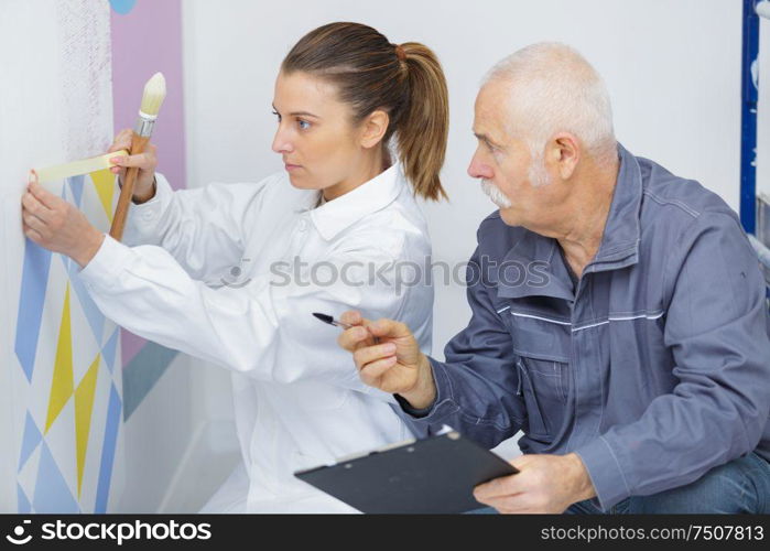 happy young woman learning to paint for job