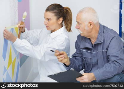 happy young woman learning to paint for job