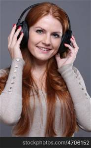 Happy young woman listening to music