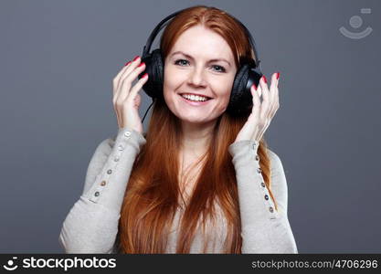 Happy young woman listening to music