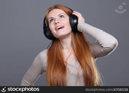 Happy young woman listening to music